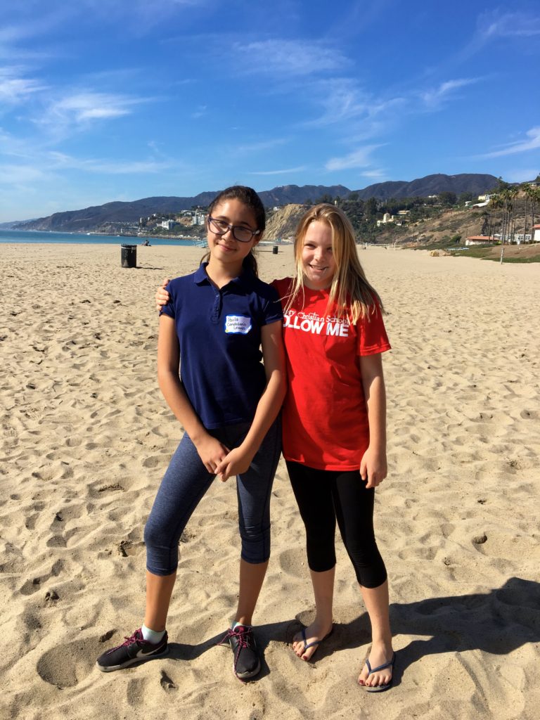 Paola and her friend from Calvary Christian school at the beach cleanup.